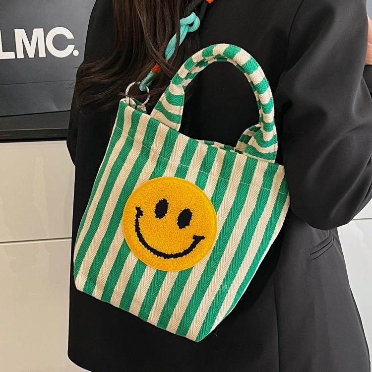 Cute smiling hand-held canvas bag large capacity simple commuting bucket bag fashionable striped design shoulder bag